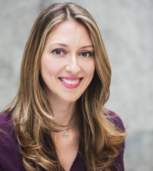 professional headshot of a white woman in her 40s, smiling