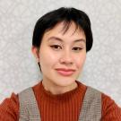 Profile portrait of Shannen Escote. I am Asian (Filipino) with short dark hair, wearing a sweater.